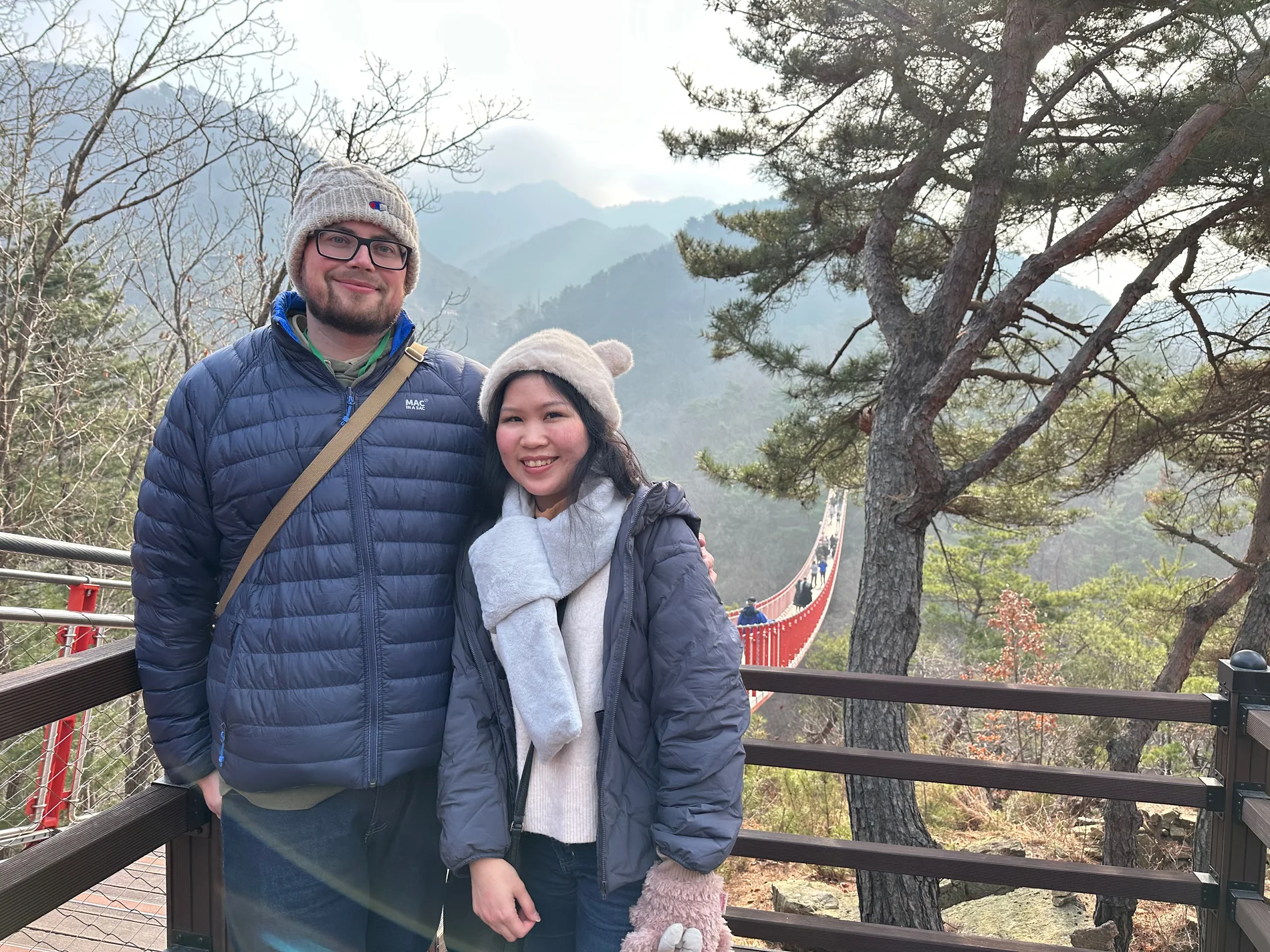 Lewis and Gail together at a mountain lookout in winter coats.