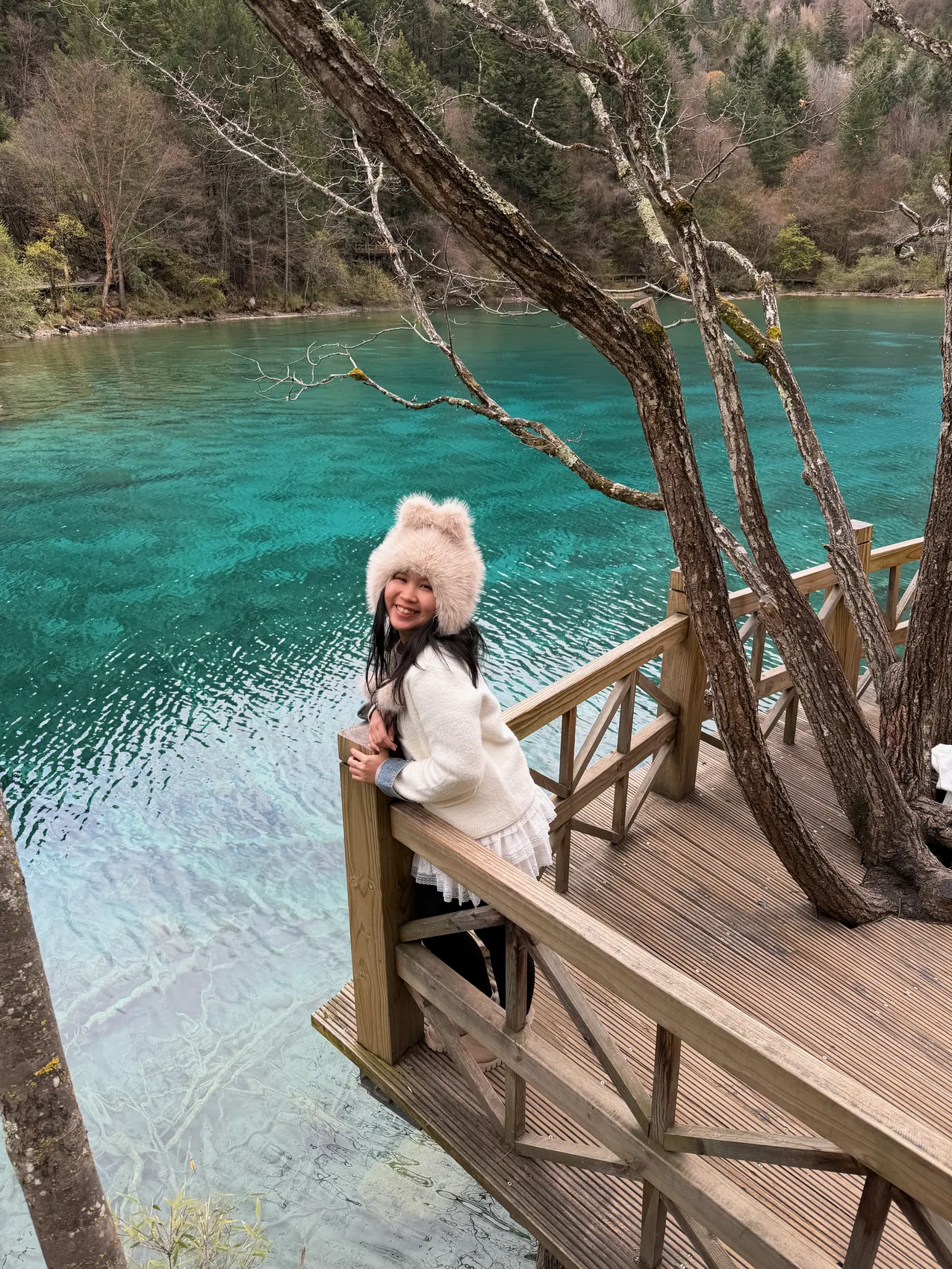 Gail standing above turquoise mountain pools.