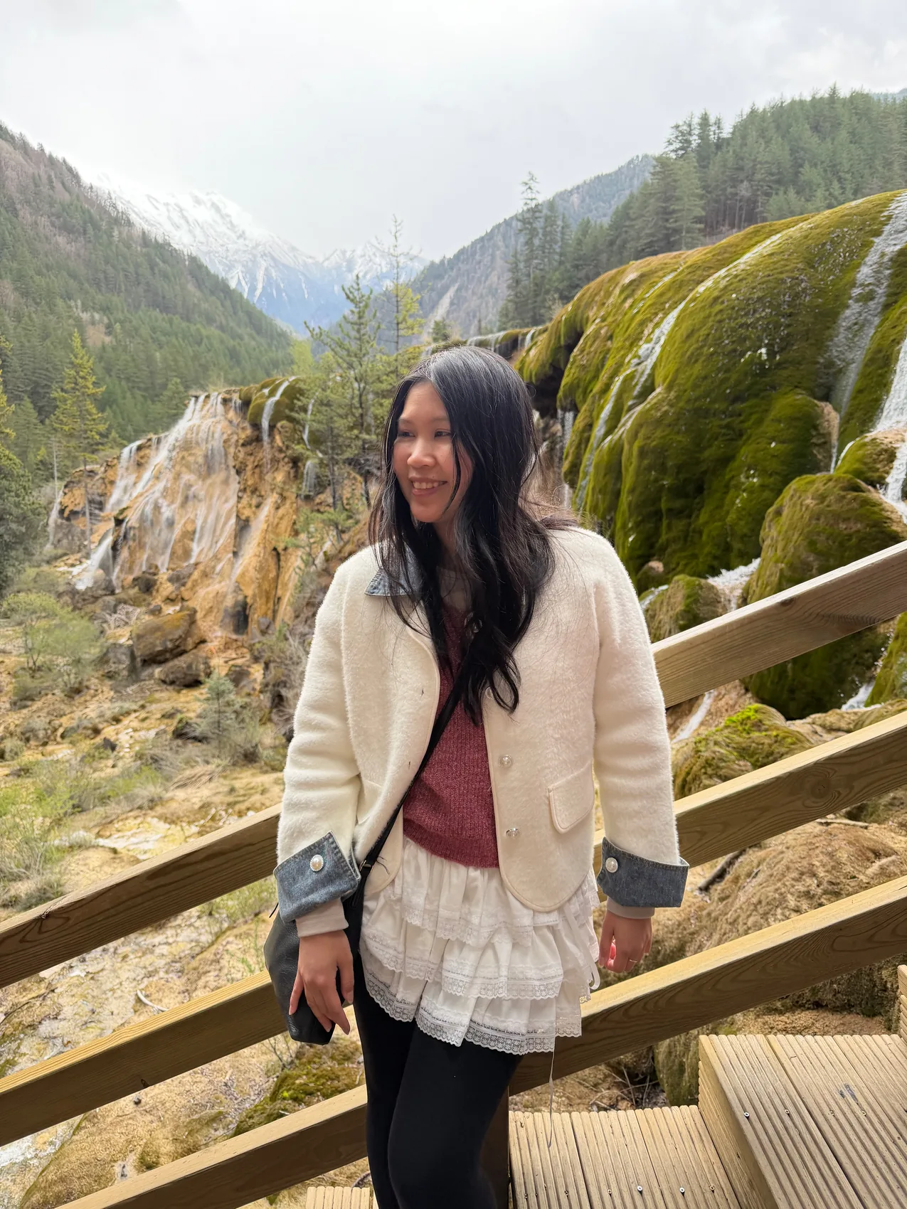 Gail smiling on a sunny mountain path.