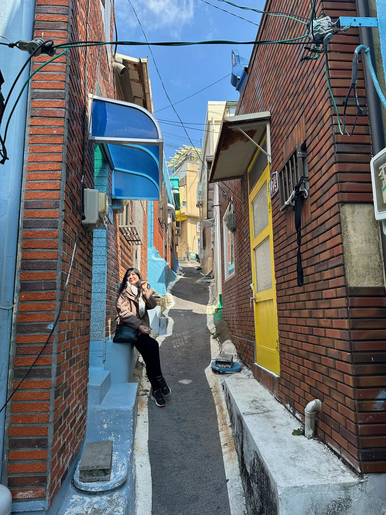 Gail posing in a colourful alley.